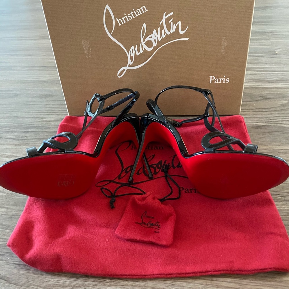 Women’s black strappy Christian Louboutin heels
